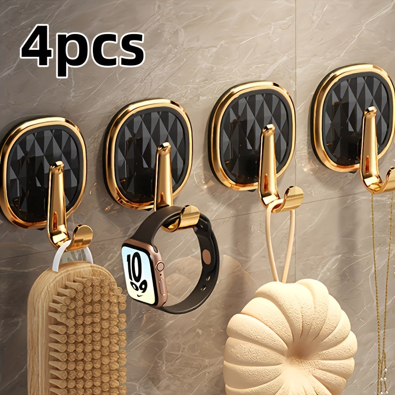 A Stylish Golden Wall-Mounted Hook for Robes And Towels Made of Rust-Resistant Plastic, Featuring a Chic Black Diamond Design. It Has a Strong Adhesive Suitable for Kitchens, Bathrooms, And for Hanging Clothes Or Keys, Utility Hooks