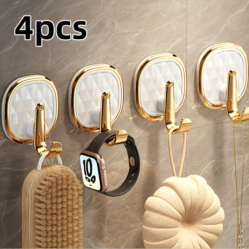 A Stylish Golden Wall-Mounted Hook for Robes And Towels Made of Rust-Resistant Plastic, Featuring a Chic Black Diamond Design. It Has a Strong Adhesive Suitable for Kitchens, Bathrooms, And for Hanging Clothes Or Keys, Utility Hooks
